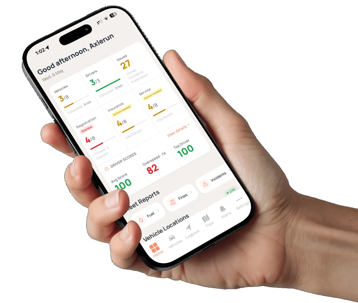 Hand holding a phone showing the Axlerun fleet overview screen